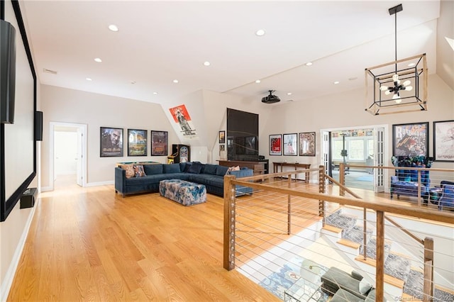 living area featuring recessed lighting, baseboards, and light wood-style floors