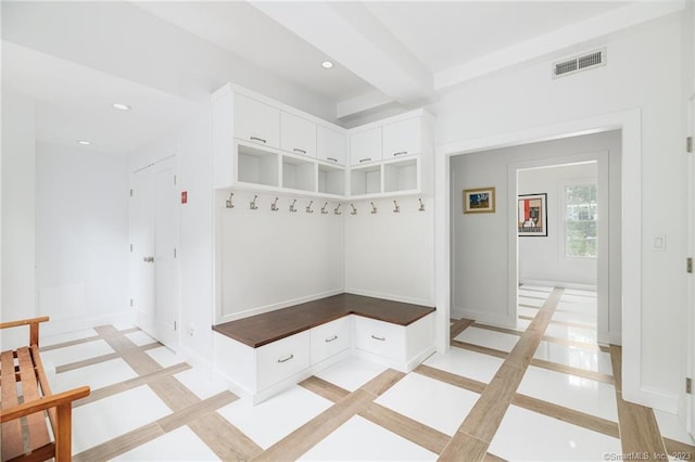 mudroom featuring beamed ceiling, recessed lighting, baseboards, and visible vents