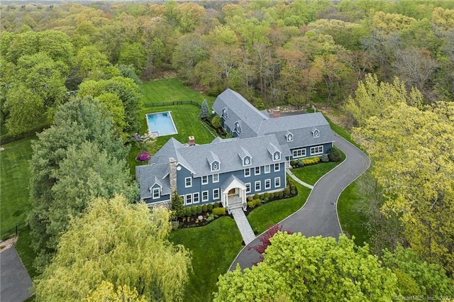 drone / aerial view with a view of trees