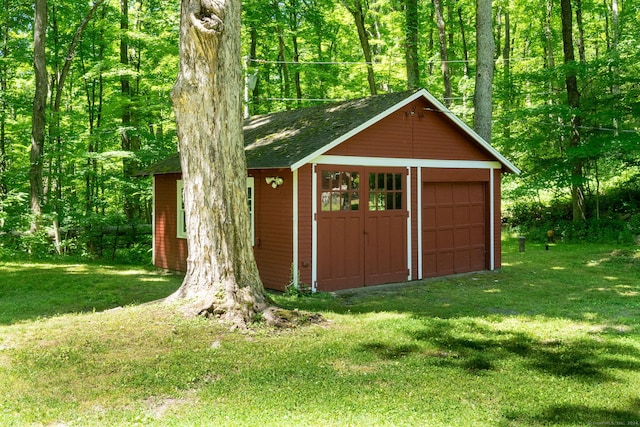 view of outdoor structure featuring a lawn