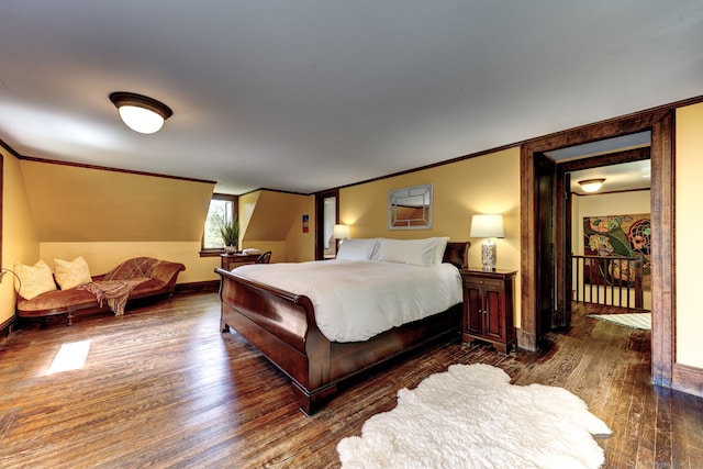 bedroom with ornamental molding and dark hardwood / wood-style flooring