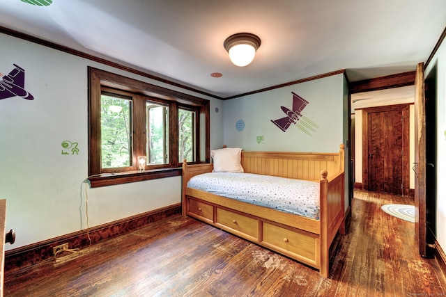 bedroom featuring dark wood-type flooring and ornamental molding