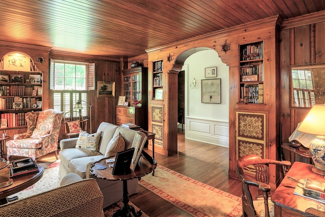 living room with hardwood / wood-style flooring, crown molding, and wooden ceiling