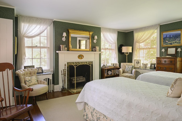 bedroom with crown molding and wood-type flooring