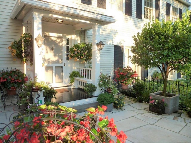 property entrance featuring a patio area