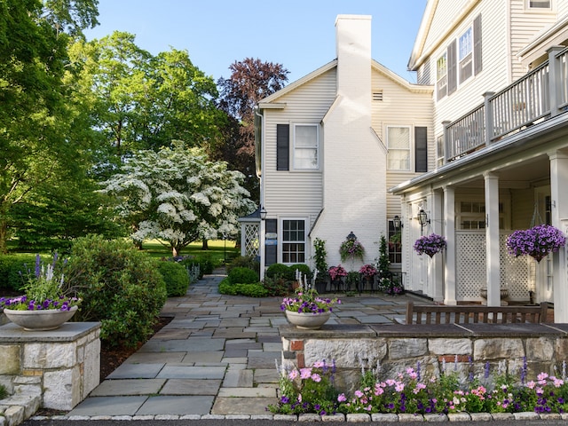 exterior space featuring a patio and a balcony