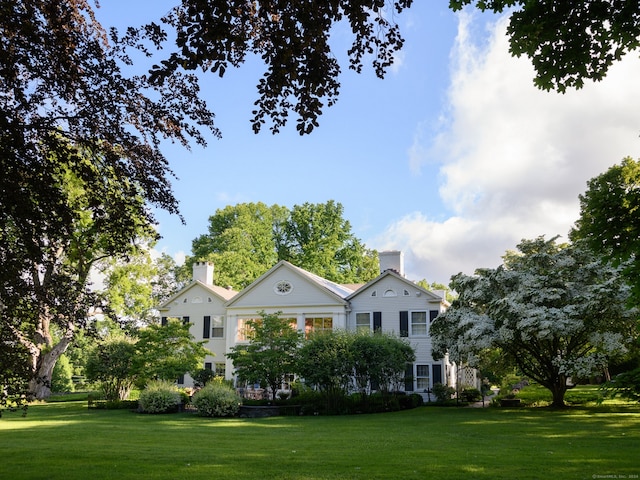 exterior space featuring a front lawn