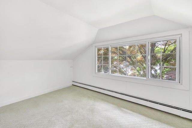 bonus room featuring lofted ceiling, baseboard heating, and carpet floors