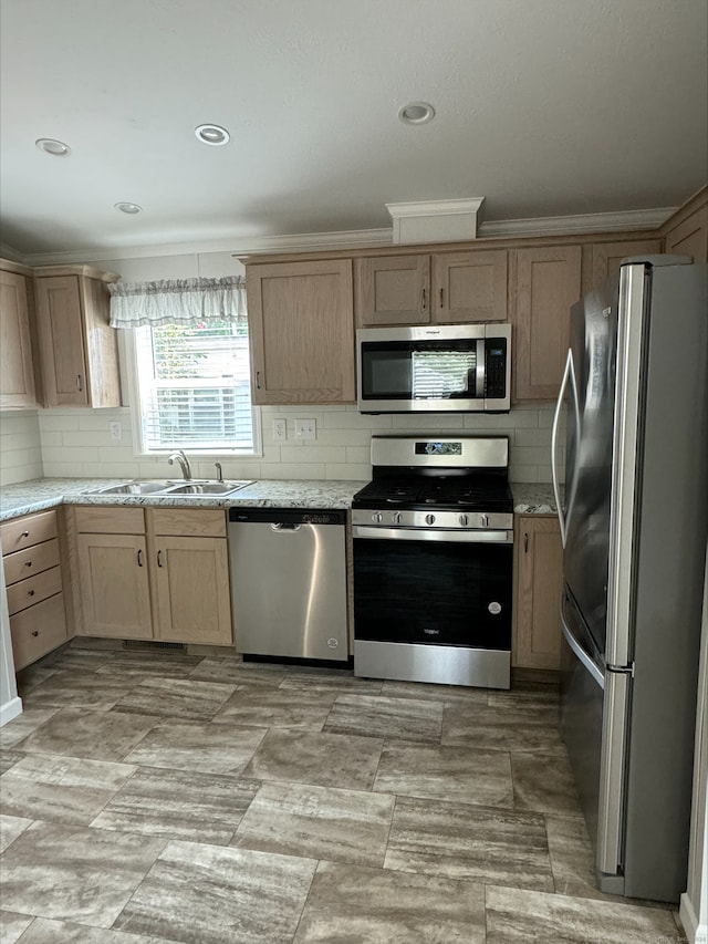 kitchen featuring light tile patterned floors, stainless steel appliances, light stone counters, and sink