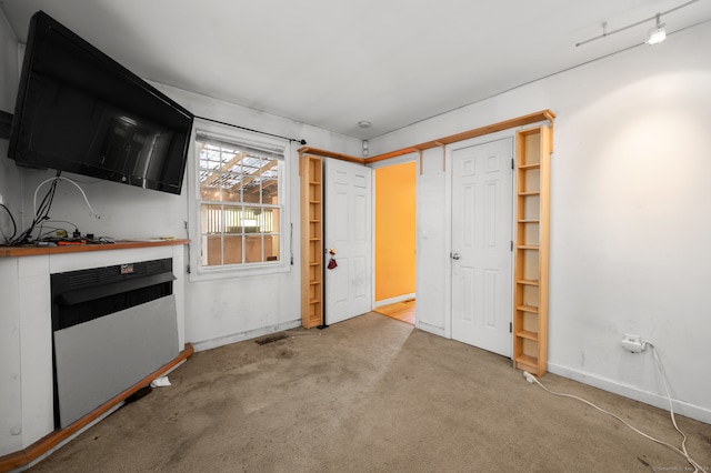 interior space with light colored carpet