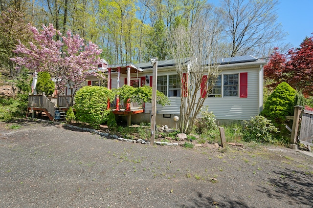 view of front of property featuring a wooden deck