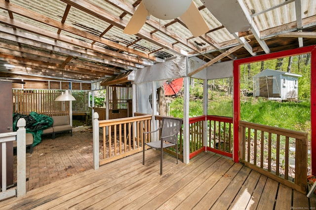 deck featuring a storage shed