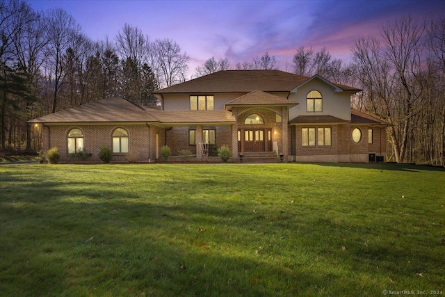 view of front of property with a yard