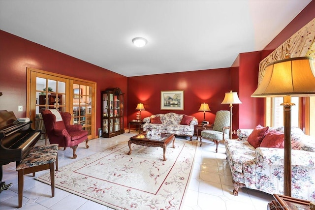 living room featuring light tile patterned floors and french doors