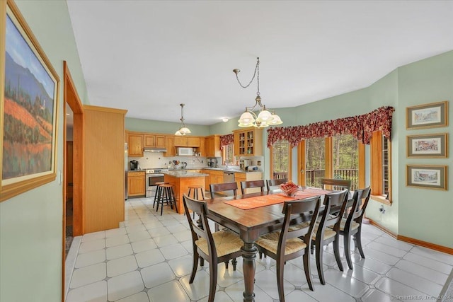 dining space featuring an inviting chandelier