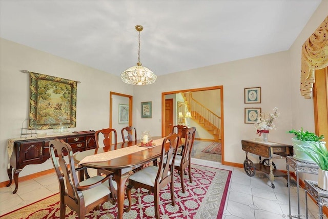 dining space featuring light tile patterned floors