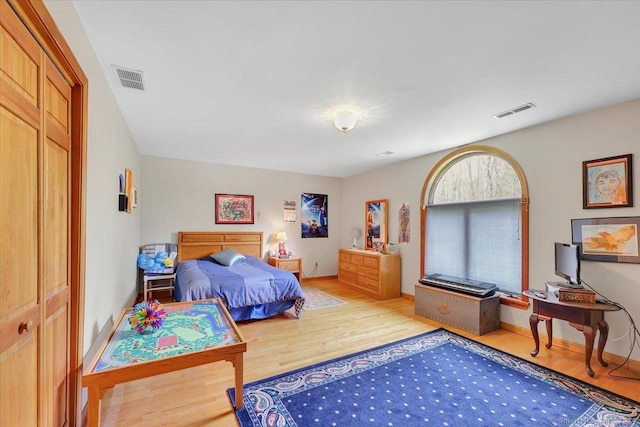 bedroom featuring a closet and wood-type flooring