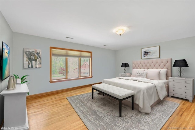 bedroom with light hardwood / wood-style flooring