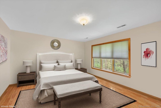 bedroom with hardwood / wood-style floors