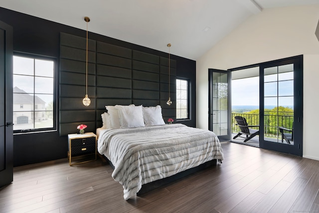 bedroom with access to outside, high vaulted ceiling, beamed ceiling, and hardwood / wood-style floors