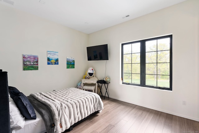 bedroom featuring hardwood / wood-style floors