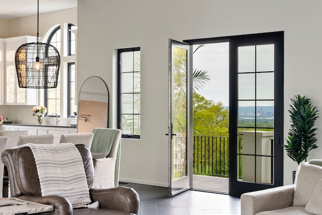 doorway to outside with a healthy amount of sunlight and hardwood / wood-style flooring