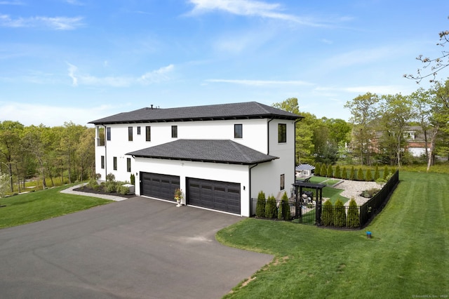 view of home's exterior featuring a garage and a yard