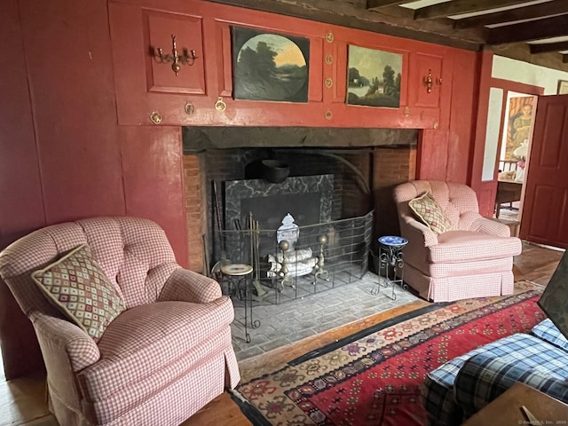 living area with beam ceiling