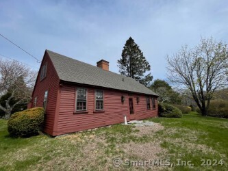 view of side of home featuring a lawn