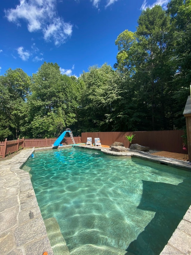 view of pool featuring a water slide