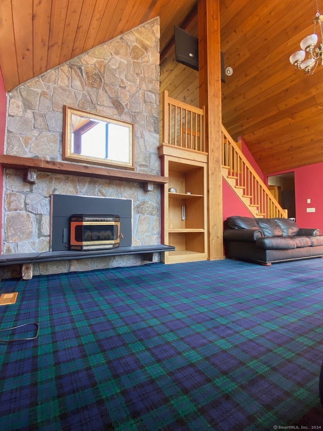 unfurnished living room with high vaulted ceiling, wooden ceiling, a stone fireplace, and a notable chandelier