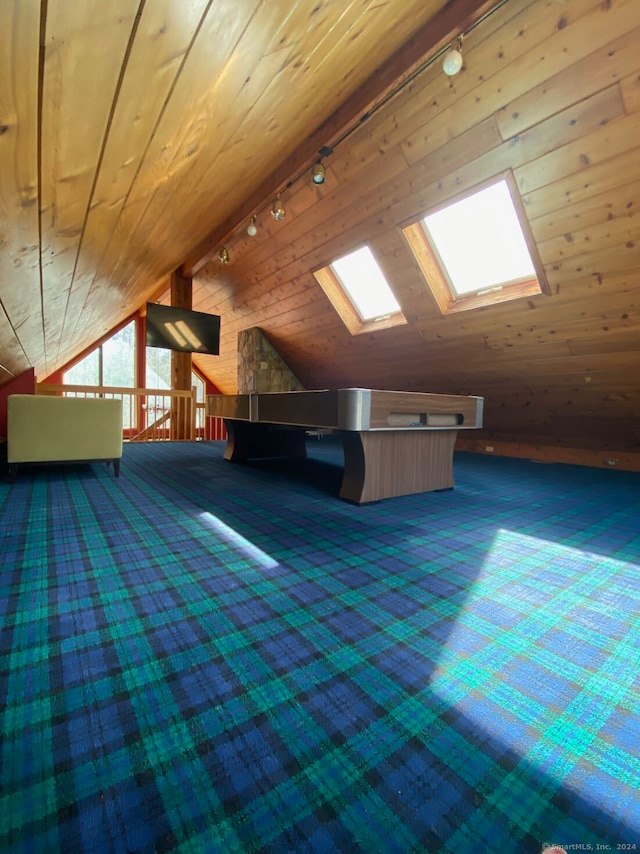 bonus room with vaulted ceiling with skylight, carpet floors, and wood ceiling