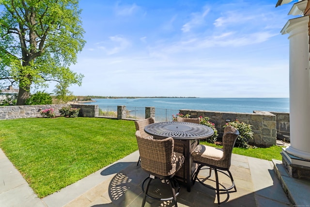 view of terrace with a water view