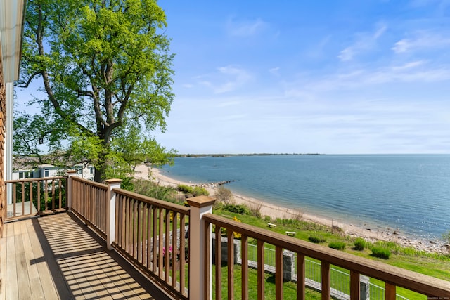 exterior space featuring a view of the beach and a water view