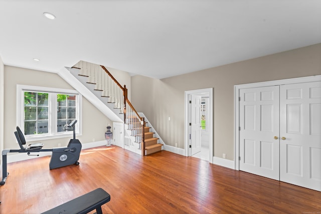 workout area with hardwood / wood-style floors