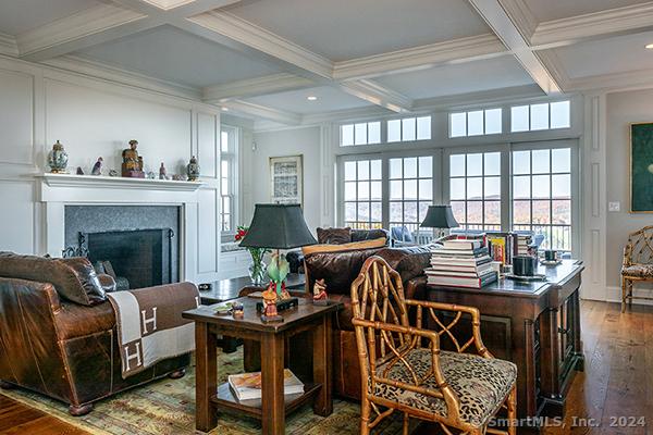 sunroom featuring beamed ceiling and coffered ceiling