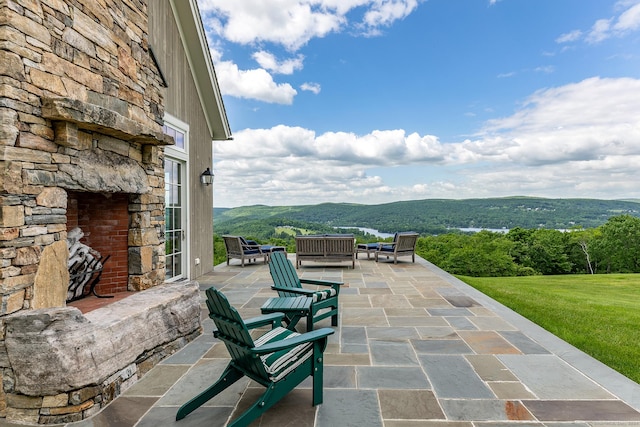 view of patio with a mountain view and an outdoor living space