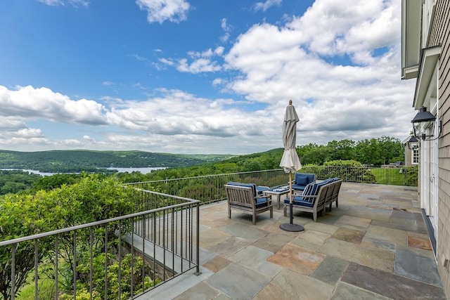 view of patio / terrace featuring outdoor lounge area and a mountain view