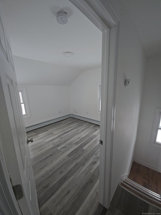 971 New Litchfield St, Torrington, CT 06790 - bonus room featuring lofted ceiling, baseboards, wood finished floors, and a baseboard radiator
