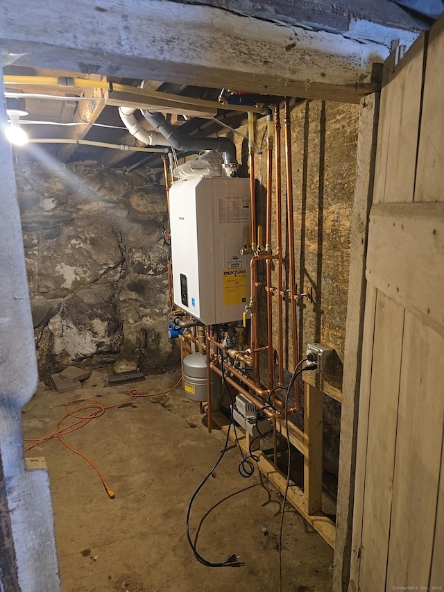 utility room featuring tankless water heater