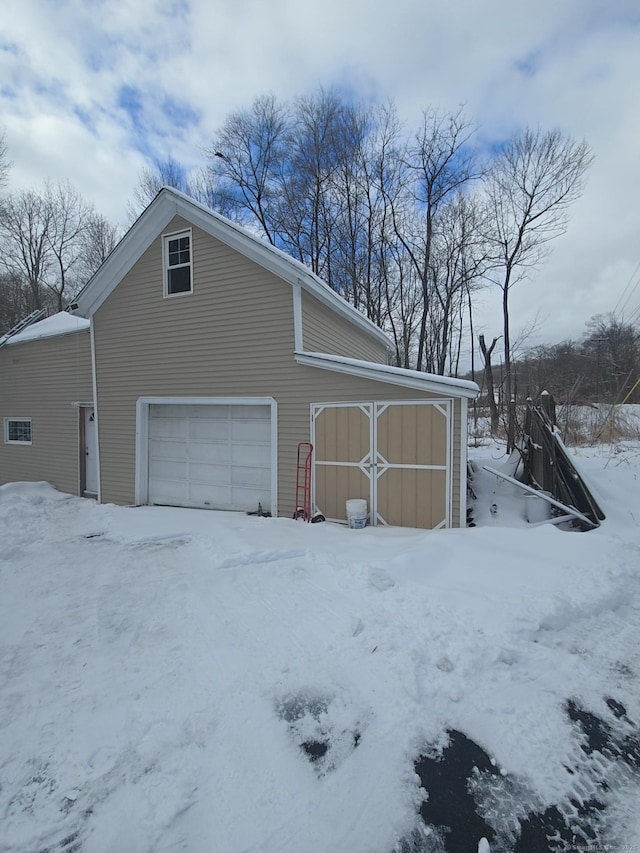 view of snow covered garage