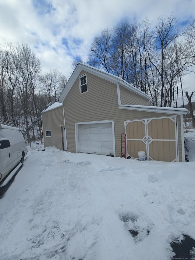 view of snow covered garage