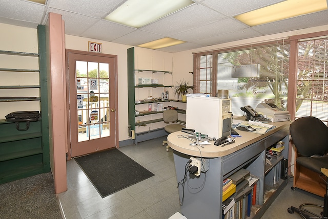 office featuring tile flooring and a paneled ceiling