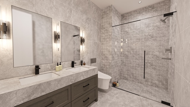 bathroom featuring tile patterned floors, tiled shower, toilet, vanity, and tile walls