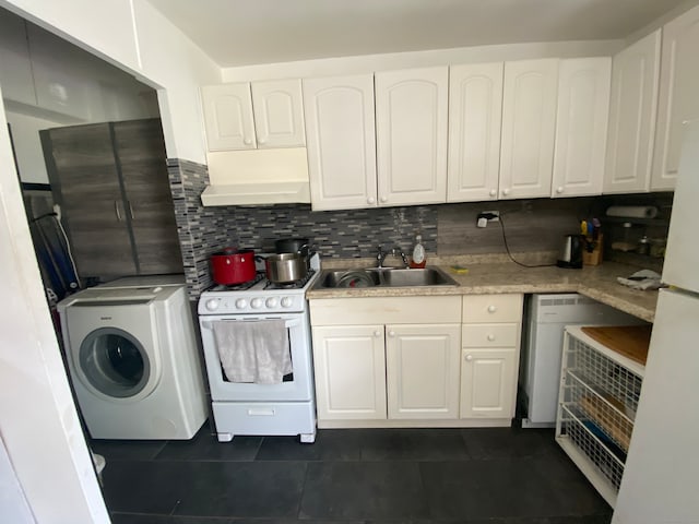 kitchen with white cabinets, sink, tasteful backsplash, washer / dryer, and white gas stove