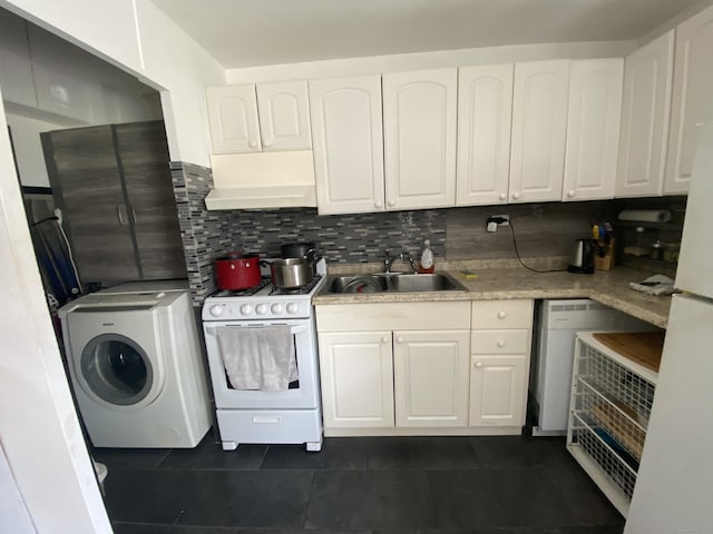 kitchen featuring white appliances, sink, premium range hood, washer / clothes dryer, and white cabinets