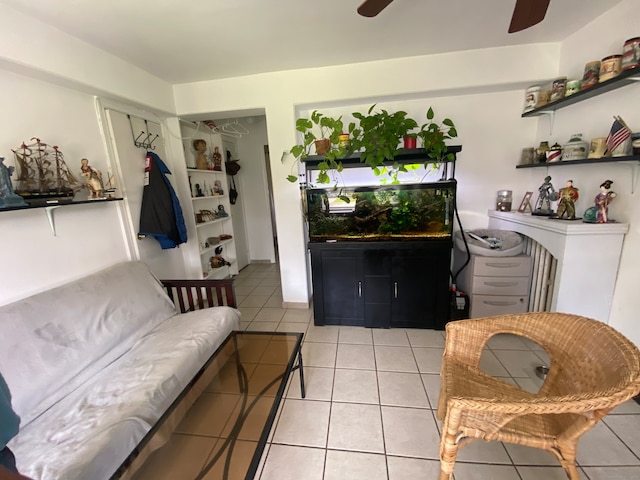 living room with ceiling fan and light tile floors