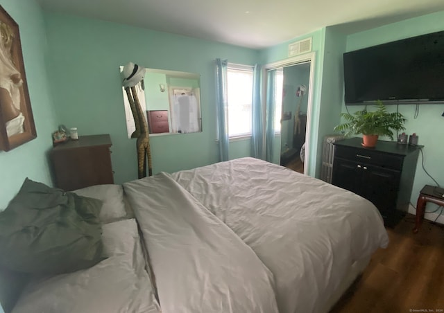 bedroom featuring hardwood / wood-style flooring