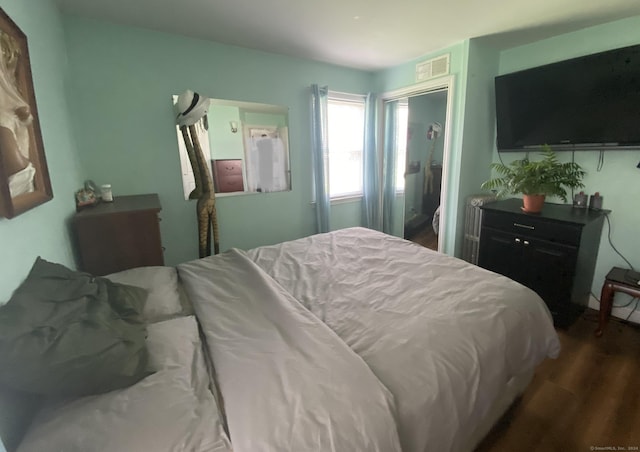 bedroom featuring dark hardwood / wood-style floors