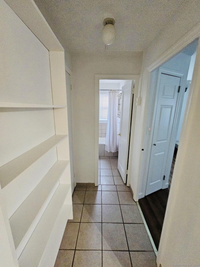 357 Granfield Ave Unit B, Bridgeport, CT 06610 - hallway featuring light tile patterned flooring